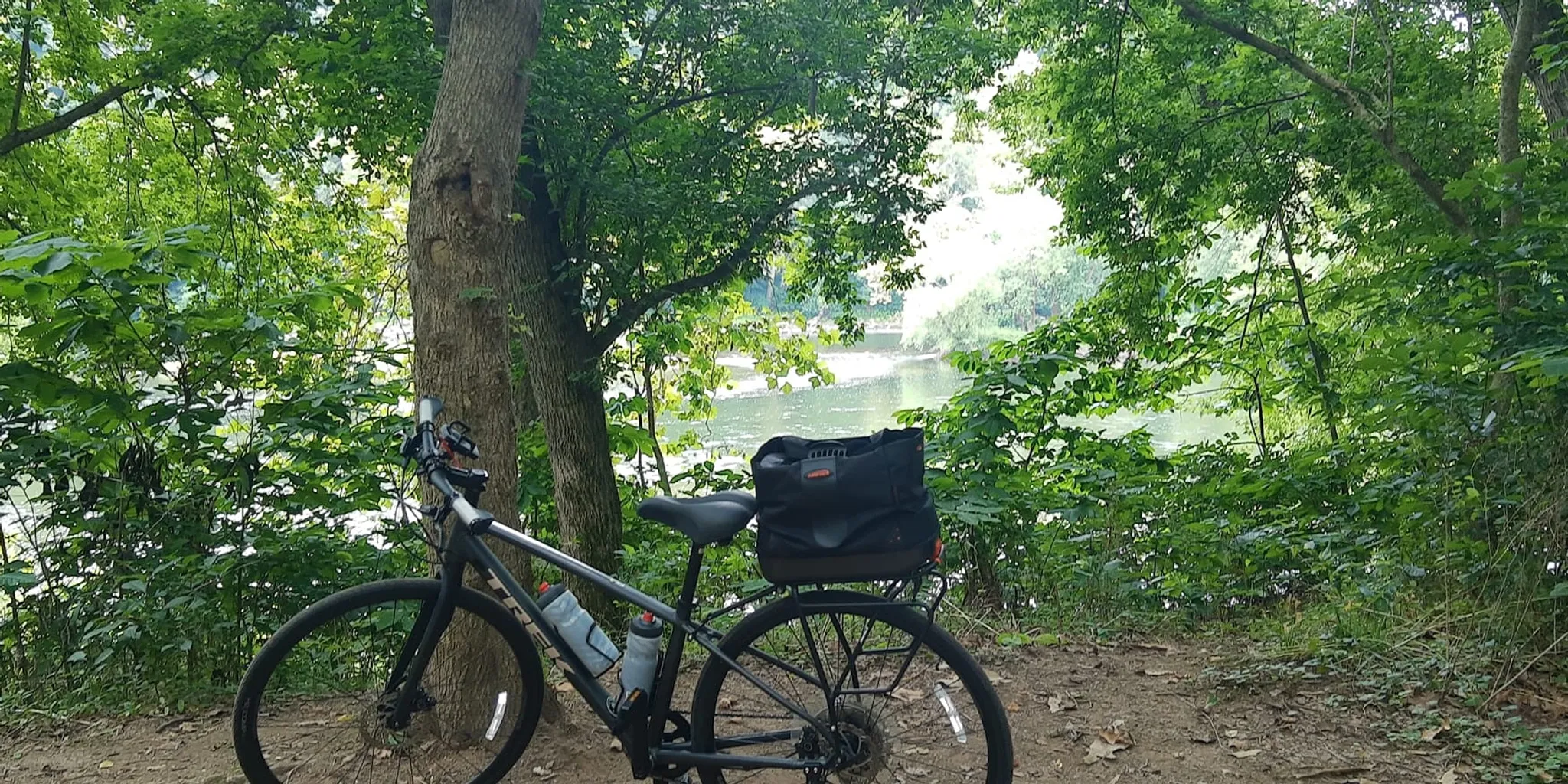 Denise's bike stopped along the river on a ride